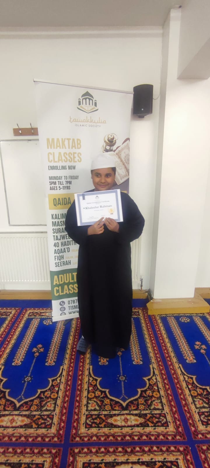 Maktab student with a completion certificate